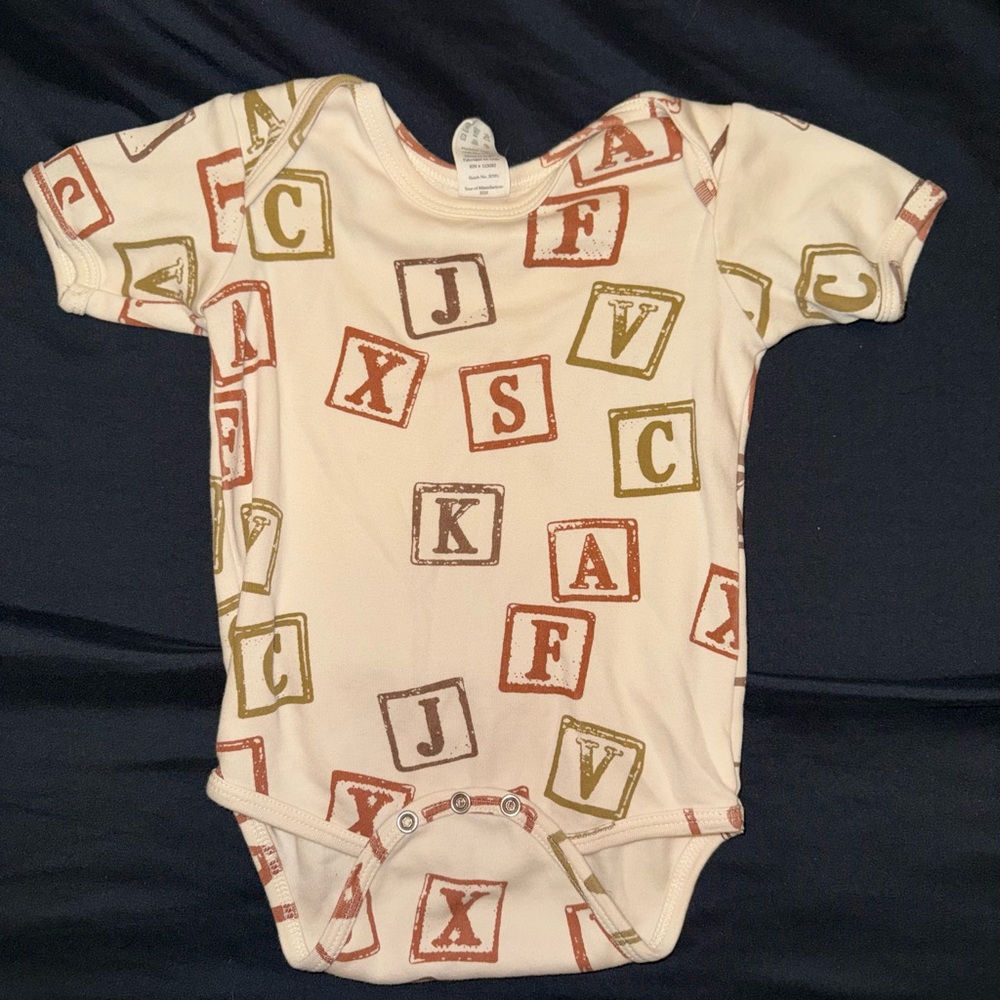 Kate Quinn Alphabet Block Print Bodysuit in Cream, Brown, and Green